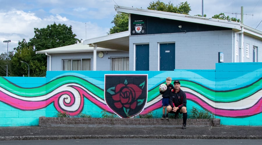 Dave O’Keeffe (left), Oliver (athlete, footballer and keen cyclist), Sean Stringfellow and Clare St Pierre outside the new mural at Te Awamutu Stadium on Armstrong Ave.
Photo / Shutter Media NZ